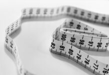 운동과 식단조절을 통한 체중감량 selective focus photography of tape measure