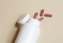 건강한 나를 위한 친구 유산균 a white bottle with red and white pills