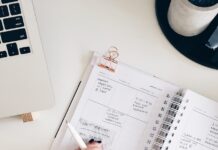건강한 삶을 위한 일상 실천 person holding notepad and pen flat lay photography