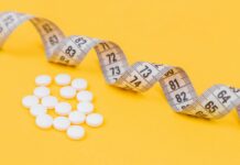 청소년 비만, 예방이 최선이다. white round medication pill on yellow surface