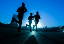 면역력 강화를 위한 운동의 역할 silhouette of three women running on grey concrete road