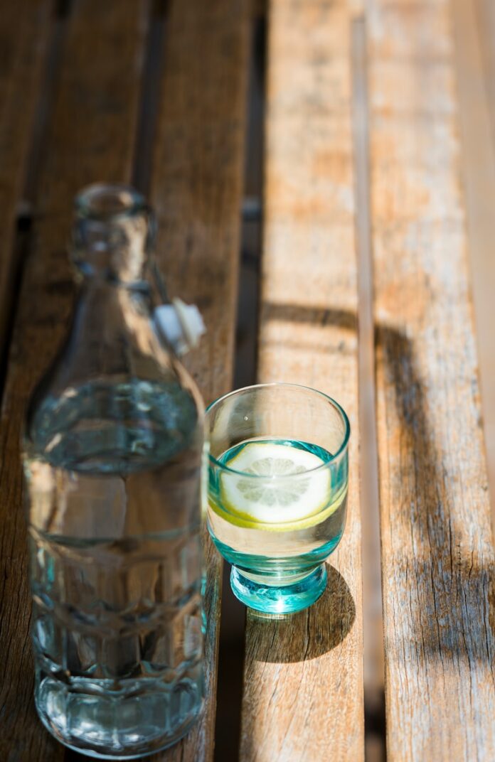 liquor in rock glass and bottle